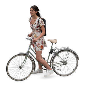 top view of a woman in a dress stopping on a bicycle