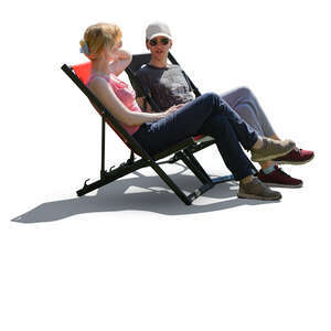two people sitting in garden chairs