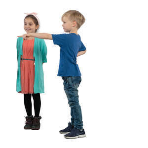 two kids standing and pointing at smth