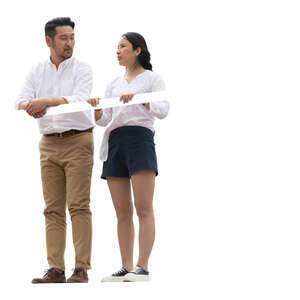 two asian people standing up on a balcony