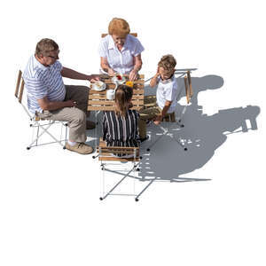 top view of grandparents sitting in a cafe with their grandkids