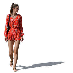 woman in a red summer dress walking