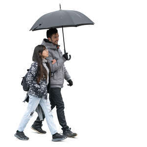 man and woman walking together under an umbrella