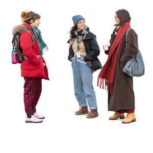 group of three women in winter standing and talking