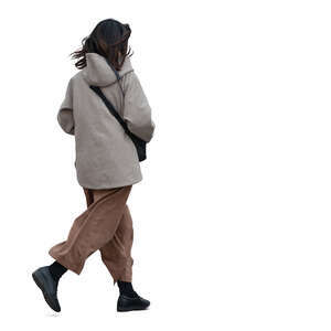 asian woman wearing a hooded jacket walking