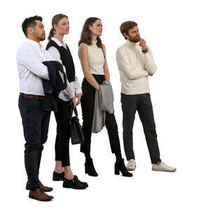 group of four people standing and looking at smth