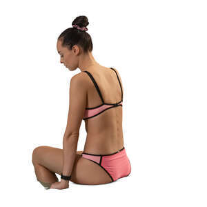 woman sitting on the edge of the pool