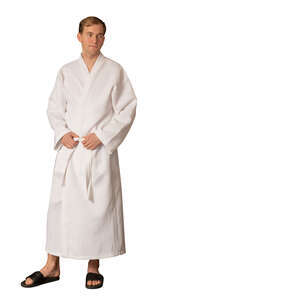 man in a white spa bathrobe standing