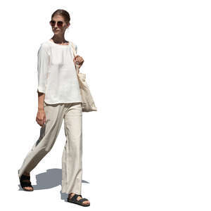 woman in relaxed white clothing walking