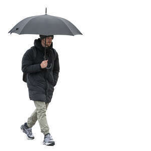 man walking on a cold rainy day