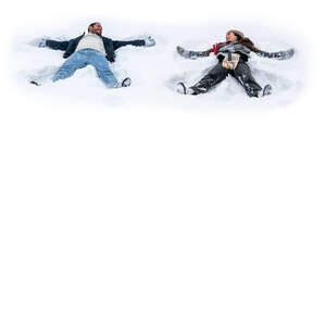 man and woman lying in the snow