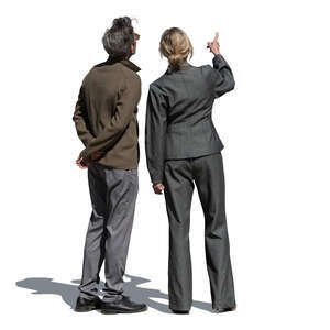 man and woman pointing at smth and looking up