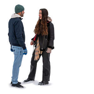man and woman standing in the snow and talking