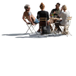 backlit image of a street cafe with group of people sitting