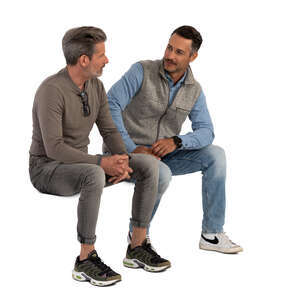 two cut out men sitting and talking