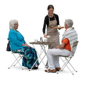 waitress serving drink to an elderly couple