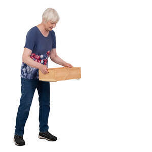 older lady lifting a wooden box