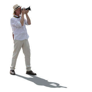 cut out backlit man taking pictures in summer