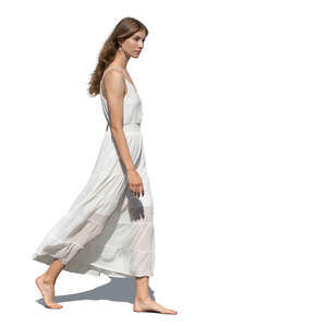 cut out woman in a white summer dress walking barefoot