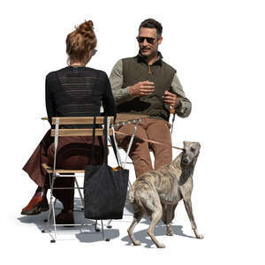 cut out man and woman and a dog sitting in a cafe