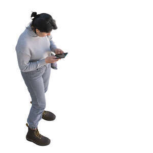 top view of a woman standing and looking at her phone