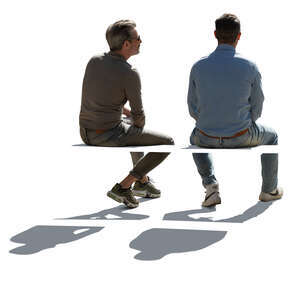 two cut out backlit men sitting seen from back angle