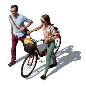 two people with a bike walking seen from above