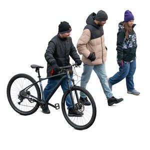 group of three people walking in winter seen from above