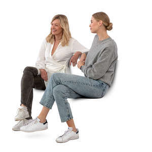 two women sitting and talking