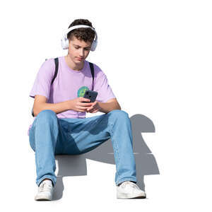 cut out teenage boy sitting and listening to music