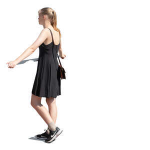 woman in a black dress standing by the railing