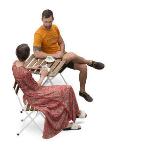 two people sitting in a cafe seen from above