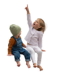 cut out two kids sitting and pointing up