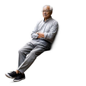 older asian man with grey hair sitting