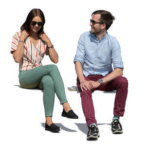 two cut out people sitting