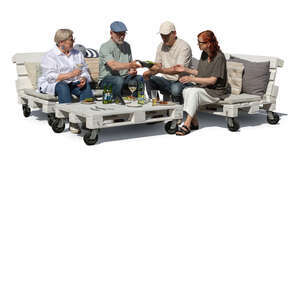 group of senior friends sitting having a garden party