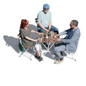 three older people sitting in a cafe seen from above