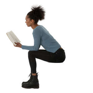 woman sitting and reading a book