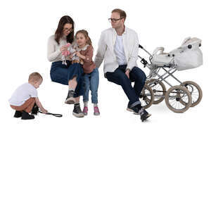 family with two kids and a stroller sitting
