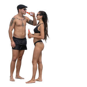 man and woman standing on the beach and drinking refreshing drinks