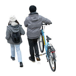 top view of two people in autumn walking with a bike