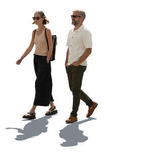 backlit man and woman walking