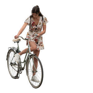 woman starting to ride a bicycle