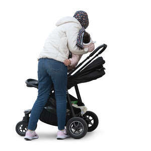 muslim woman putting her child in the stroller