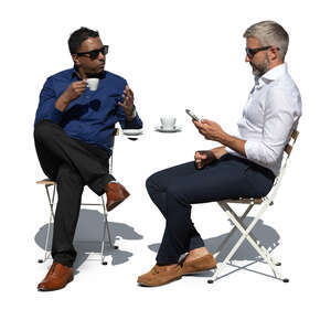 two men sitting in an outdoor coffeeshop and talking
