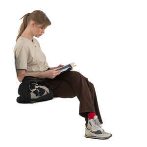 woman sitting and reading a book