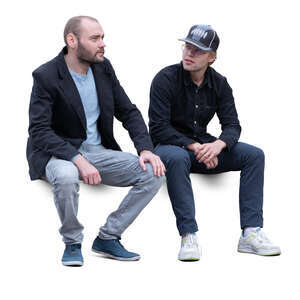 two cut out men sitting and talking