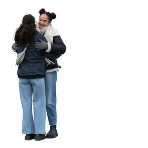 two cut out women hugging in winter