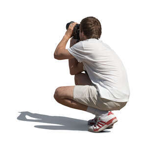cut out man squatting and taking pictures