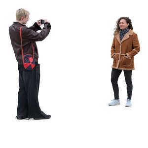 cut out man taking a picture of a woman